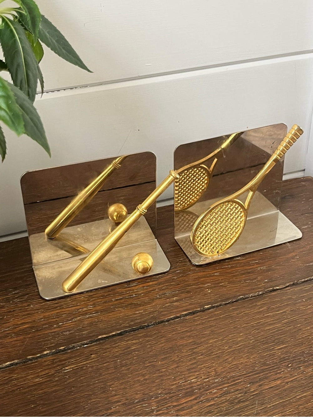 Vtg mirrored metal bookends, tennis racket, baseball bat gold accents